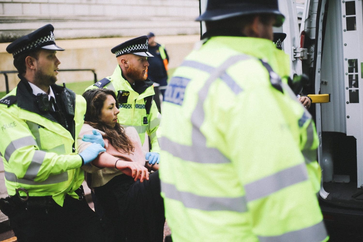 Cops arresting an XR activist at the Treasury