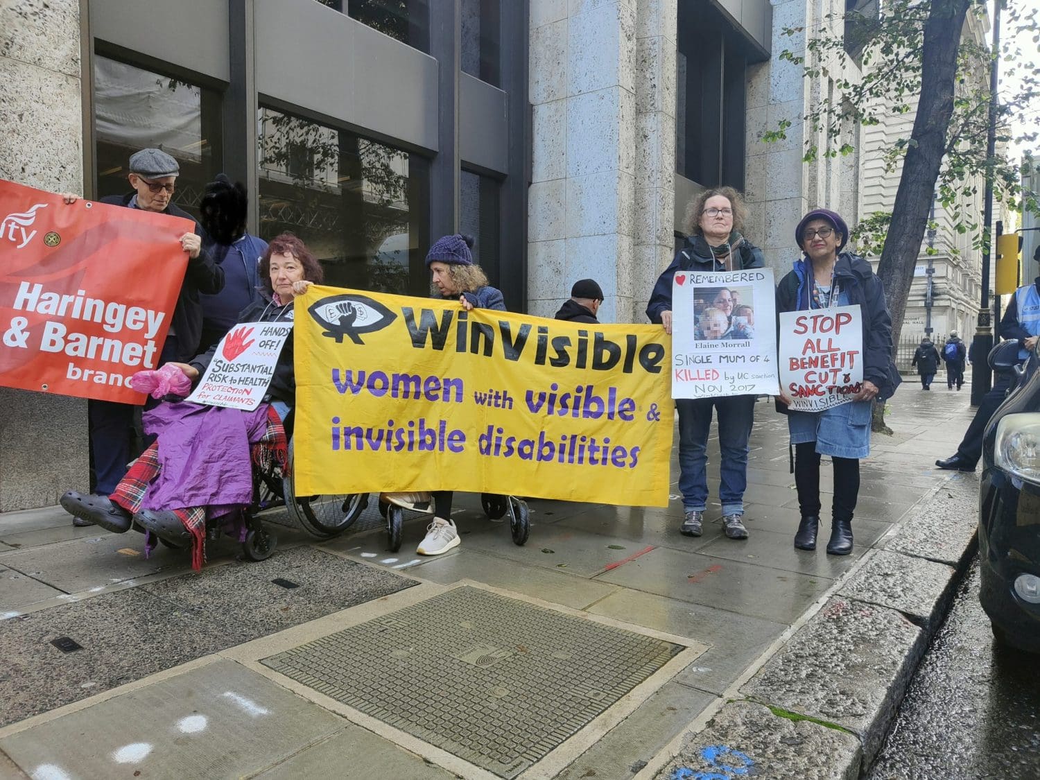 Campaign group WinVisible holding a banner at the DPAC DWP protest which reads 'winvisible women with visible and invisible disabilities'