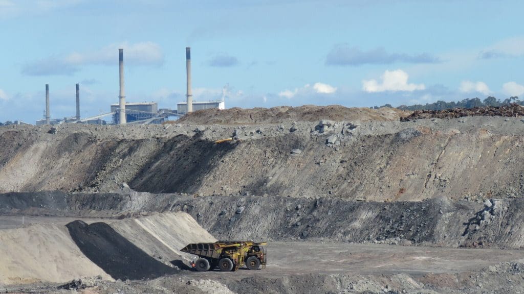 Coal mine and power plant in the background.