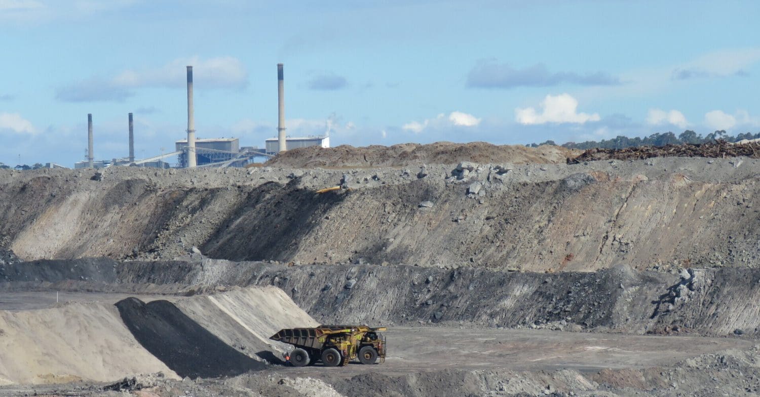 Coal mine and power plant in the background.