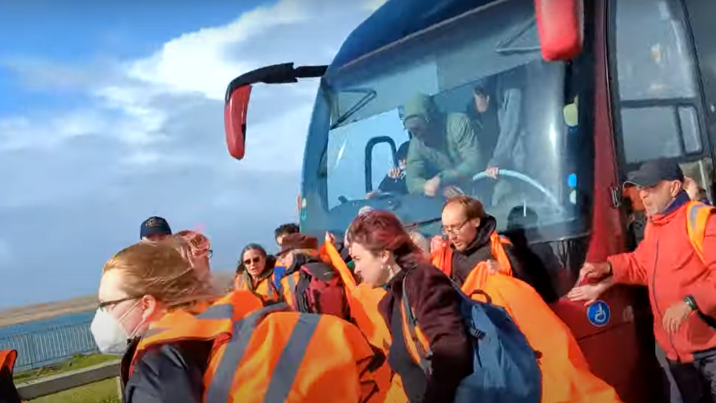 Just Stop Oil try to halt the coach taking asylum seekers to the Bibby Stockholm barge at Portland, Dorset.