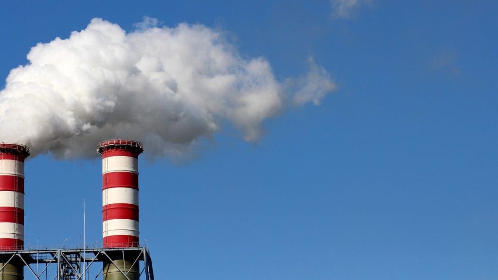Pollution rising from industrial smoke stacks.