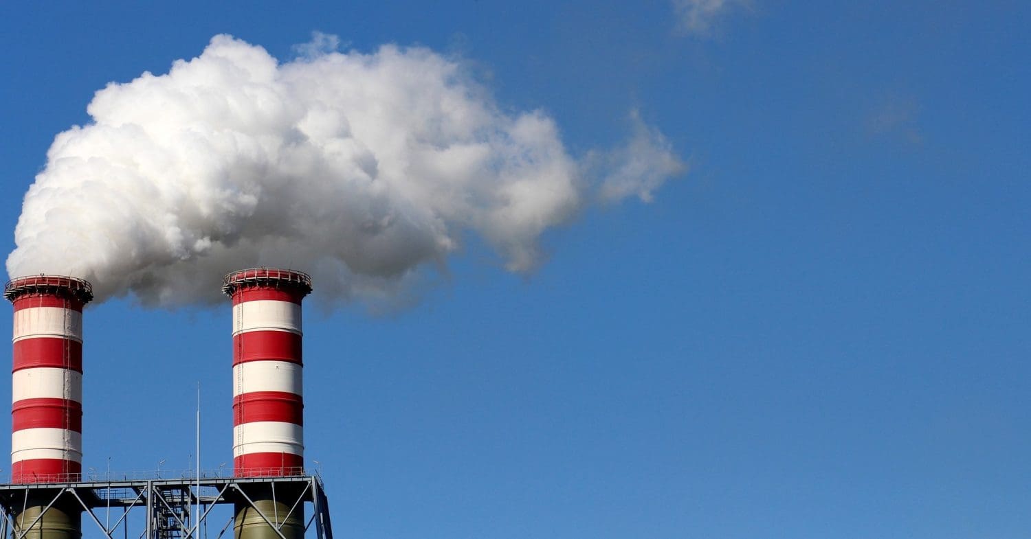 Pollution rising from industrial smoke stacks.