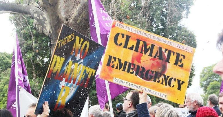 Placards at a climate protest that read 'There's no Planet B' and 'Climate Emergency'