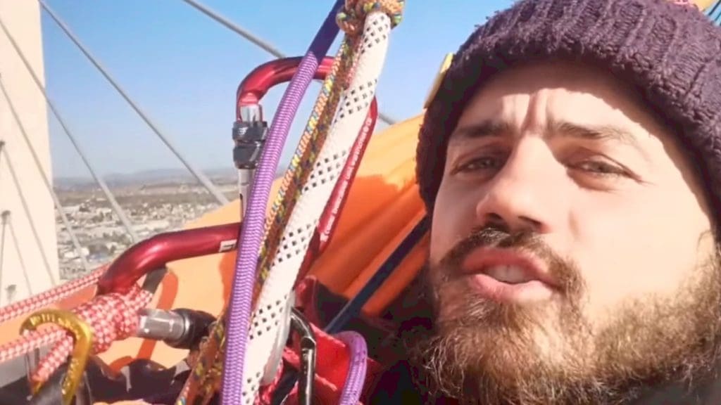 Close-up of Marcus Decker on top of Dartford Crossing during a Just Stop Oil protest