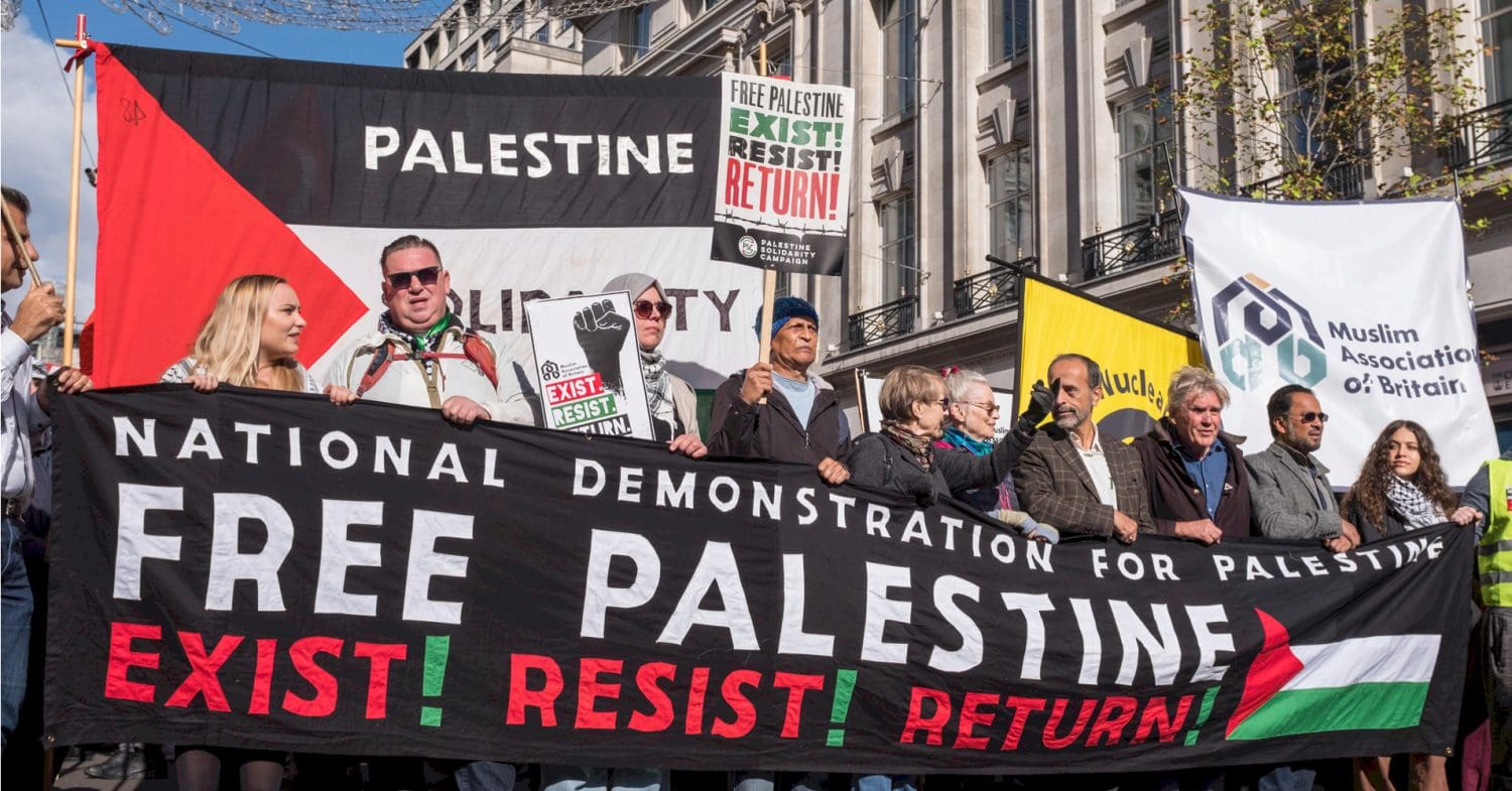 Marchers in London hold a banner saying "Free Palestine"