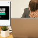 A man with his head in his hands with a Labour tweet superimposed over the image Rwanda