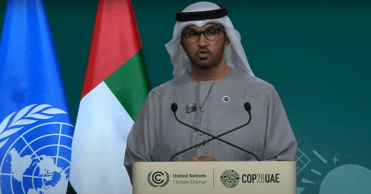 COP28 president sultan Al Jaber standing at the podium during the closing plenary of the summit.