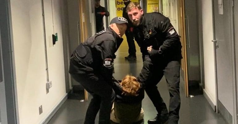 Security removing a student at universities of manchester