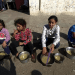 children in Gaza with food bowls