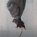 A hand holding a mouse forced swim test PETA animal rights
