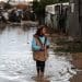 Gaza climate crisis a girl standing in flood water