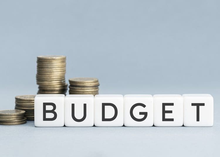 Household budgets TUC the word 'budget' on white blocks with coins