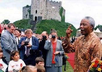 Nelson Mandela in front of a castle in Wales
