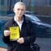 Welsh language campaigner holding a parking fine