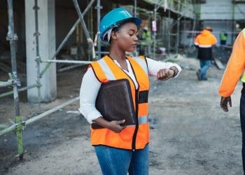 woman looking at her watch women's pay day