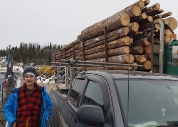 A campaigner standing next to a Drax truck