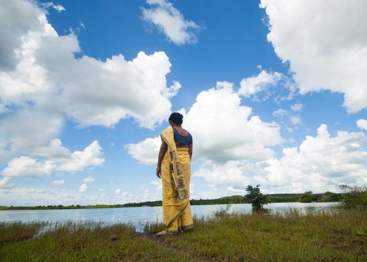 A woman looking at the sky climate finance