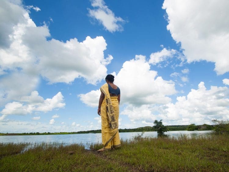 A woman looking at the sky climate finance