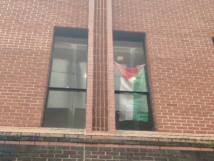 Bristol University occupation a Palestinian flag in a window