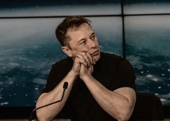 Elon Musk at a press conference Tesla