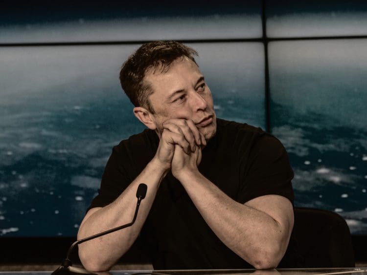 Elon Musk at a press conference Tesla