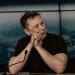 Elon Musk at a press conference Tesla
