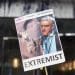 GB News a placard with a picture of Lee Anderson that says extremist