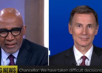 Jeremy Hunt smirking speaking to Trevor Phillips