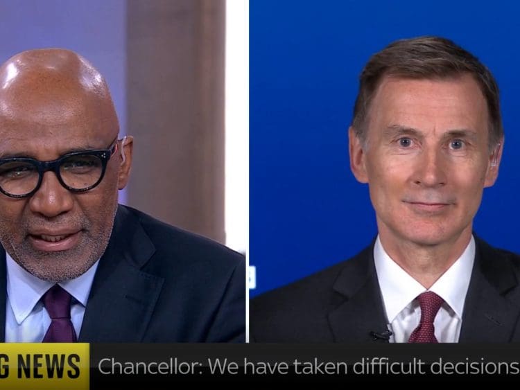 Jeremy Hunt smirking speaking to Trevor Phillips