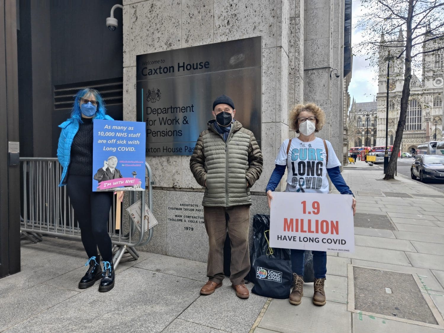 Long Covid Awareness Day campaigners standing outside the DWP