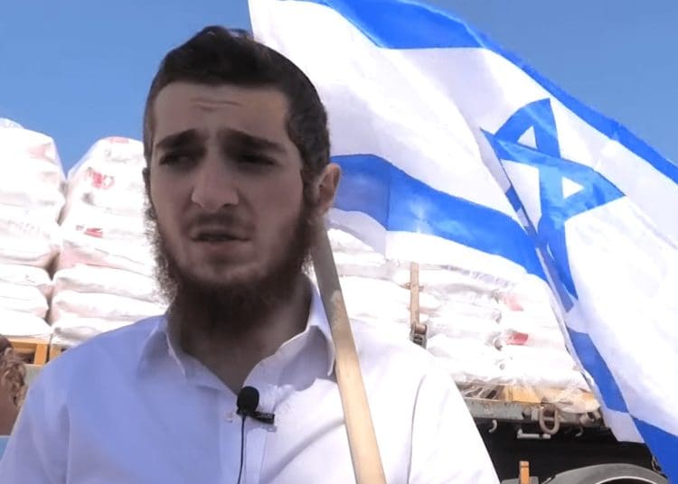Israel settler holding the Israeli flag