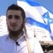 Israel settler holding the Israeli flag