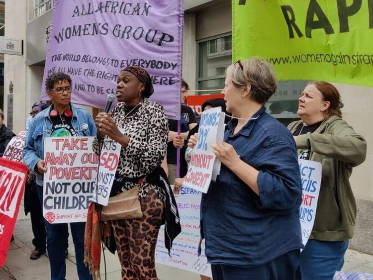 Mothers protesting outside a family court IWD