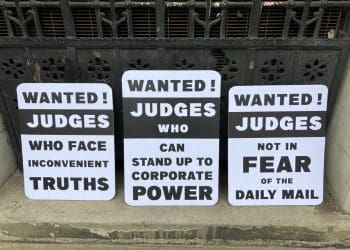 Protest placards over Judge Reid