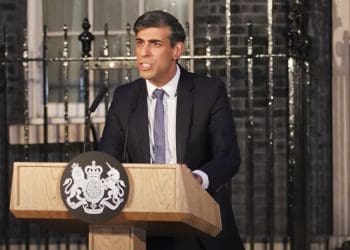Rishi Sunak looking angry standing at a podium outside 10 Downing street UNCRPD