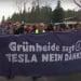 Protesters in Germany march with a banner that reads: "GrunHeide sagt TESLA NEIN DANKE" which translates to "Grunheide says TESLA NO THANKS" Musk