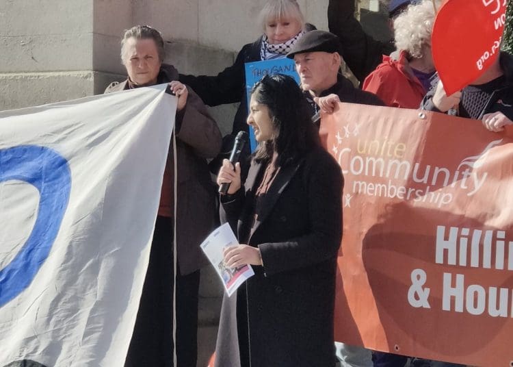 Zarah Sultana speaking at an energy bill protest at parliament