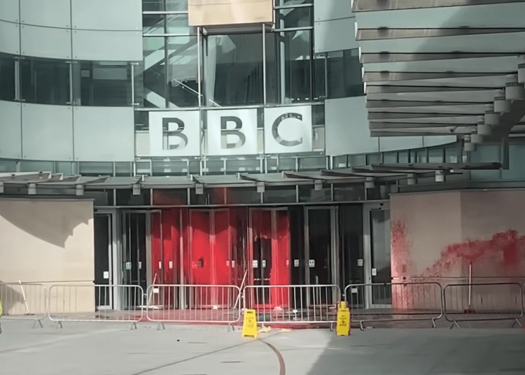 A picture of the BBC building soaked in red paint ME Awareness Day