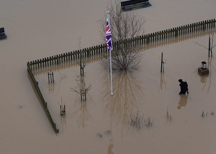 flooding with a union jack in the middle Committee on Climate Change
