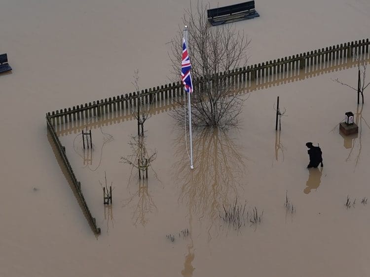 flooding with a union jack in the middle Committee on Climate Change
