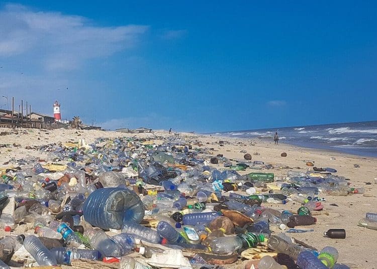 Image shows plastic pollution covering Accra beach, Ghana INC