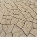 Fissures in dried out mud from extreme heat climate crisis europe
