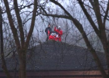 Palestine Action on the roof of Teledyne arms manufacturer that supplies Israel