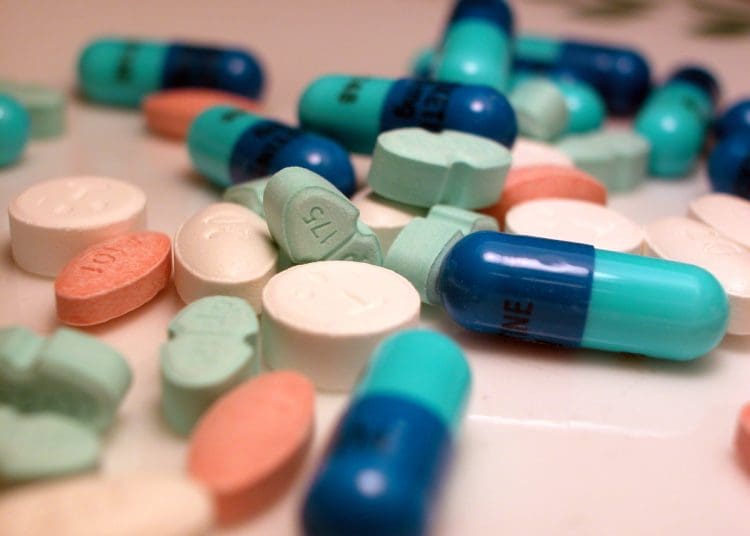 Different pills manufactured by pharmaceutical companies.