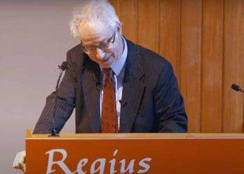 Simon Wessely speaking on a podium ME inquiry