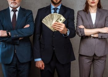 Bankers holding money bankers bonuses