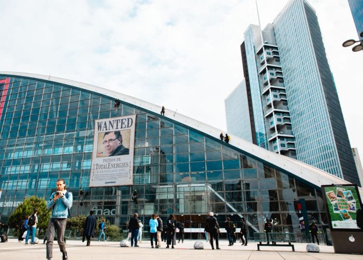 Greenpeace France activists unfurl a giant portrait of Patrick Pouyanné, CEO of the TotalEnergies with a word "Wanted" at the heart of La Défense, in France, near the headquarters of the French oil and gas company, where the annual general meeting (AGM) of shareholders is taking place.