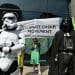 Climate Choir protesters stand alongside Darth Vader and a Storm Trooper outside Standard Chartered's AGM.