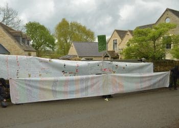 Naming the Dead banners outside David Cameron's private gates Israel